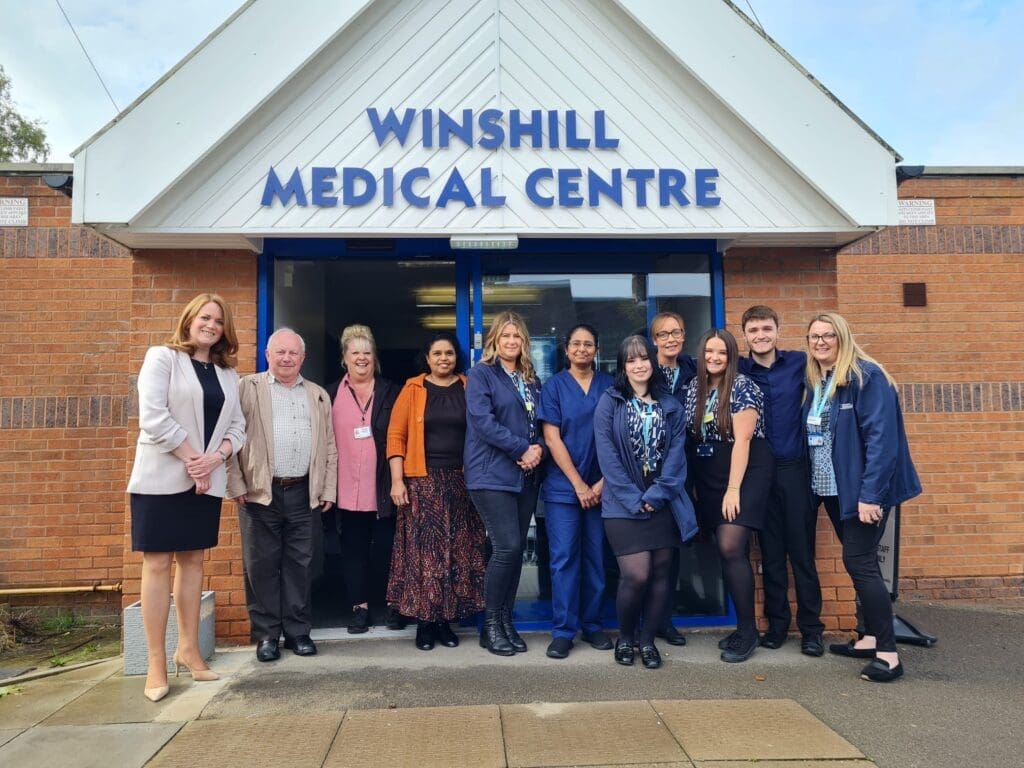 Picture of Kate Kniveton MP outside Winshill Medical Centre, accompanied by team